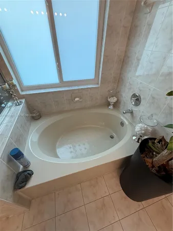a bath tub sitting in a bathroom