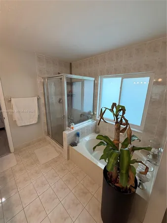 a view of living room with furniture and flowers