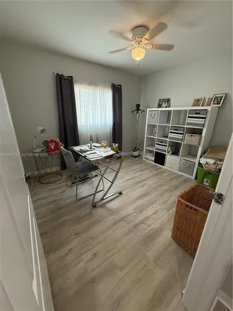 a bedroom with a bed and a mirror