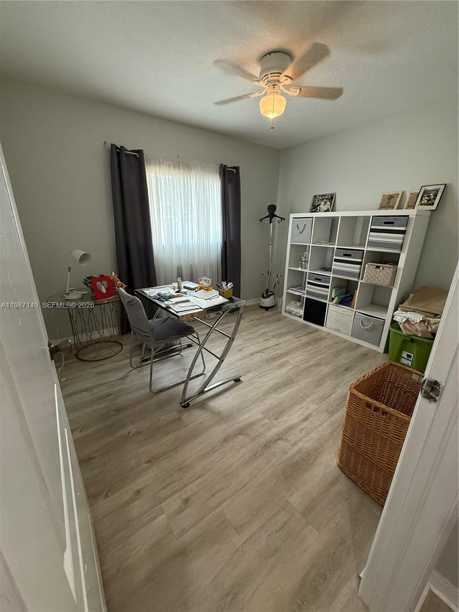18164 Southwest 149th Place Miami, FL 33187 - Photo 23 of 30 a living room with furniture a dining table and chairs