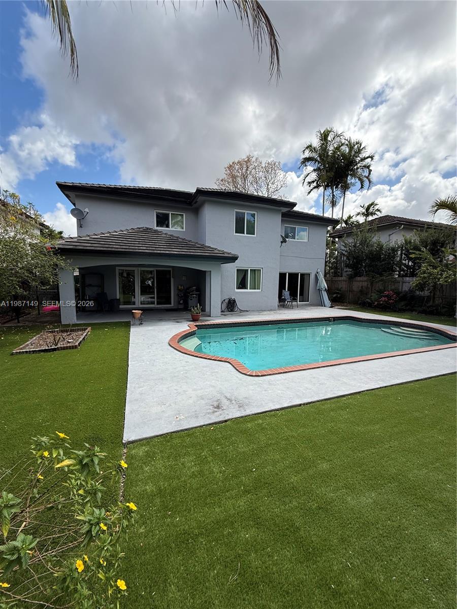18164 Southwest 149th Place Miami, FL 33187 - Photo 29 of 30 a view of outdoor space yard and swimming pool