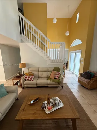 a living room with furniture and a table