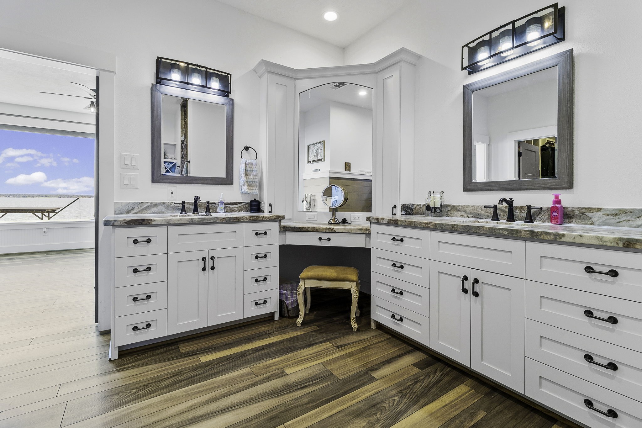 151 Key Largo Loop Point Blank, TX 77364 - Photo 19 of 49 Thoughtfully designed primary bath features dual vanities, markup vanity, marble surfaces and exceptional storage.