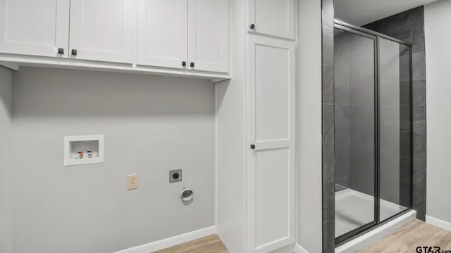 a view of a room with wooden floor