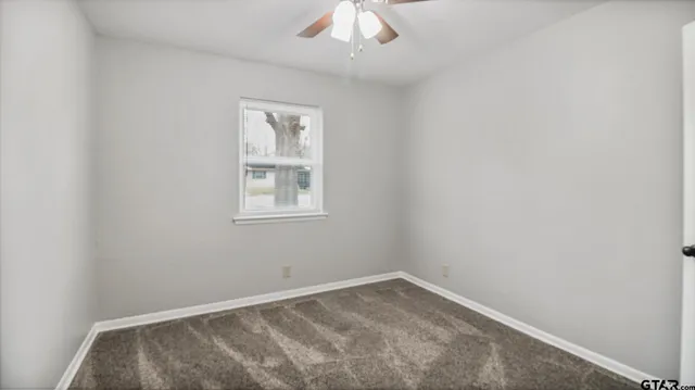 a kitchen with a sink and a toilet