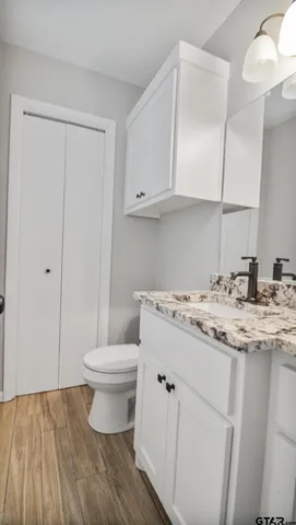 a view of a backyard with a large tree