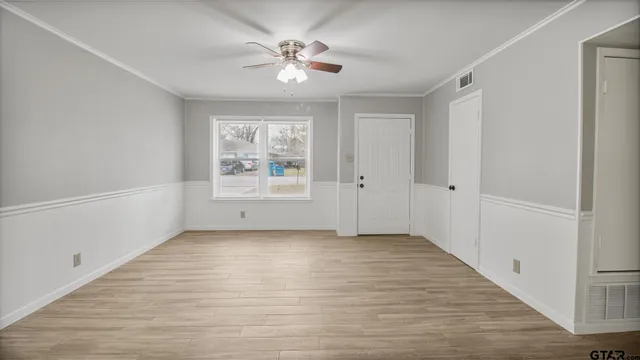 a view of an empty room with a window