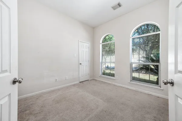 an empty room with windows