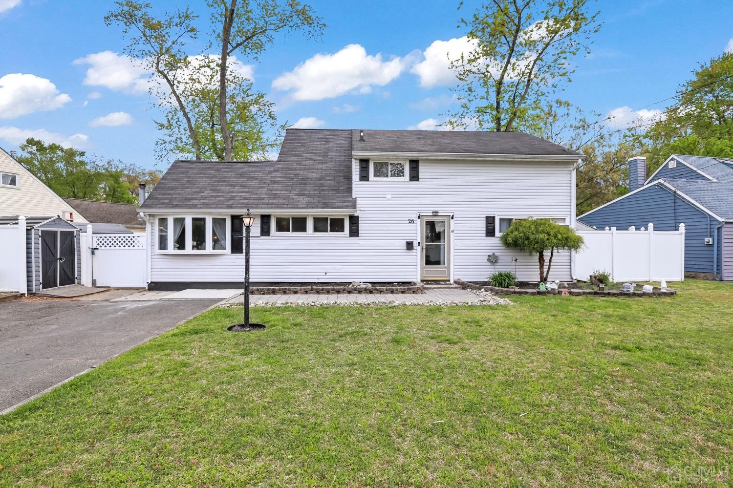 26 Sunrise Road Old Bridge, NJ 08857 - Photo 1 of 33 front view of a house with a yard