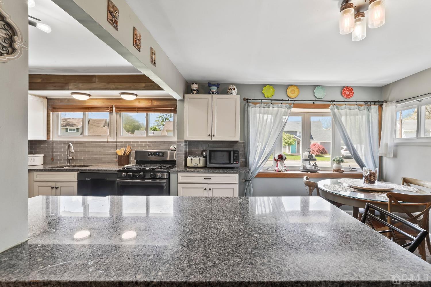 26 Sunrise Road Old Bridge, NJ 08857 - Photo 11 of 33 a kitchen with sink refrigerator and window