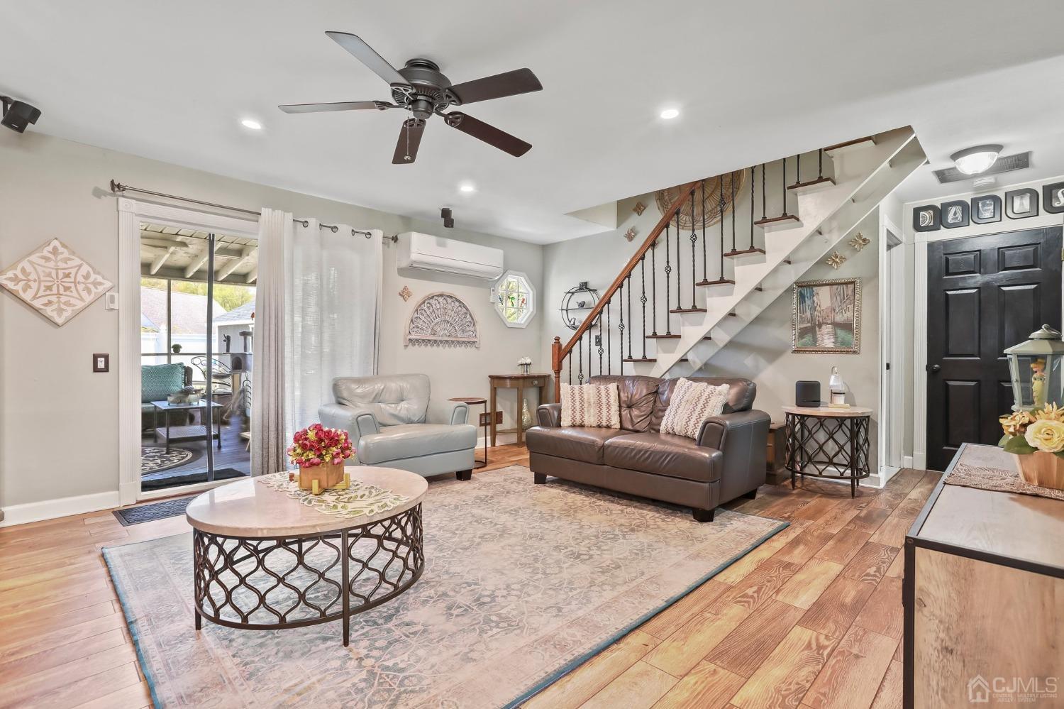 26 Sunrise Road Old Bridge, NJ 08857 - Photo 14 of 33 a living room with furniture ceiling fan and a rug