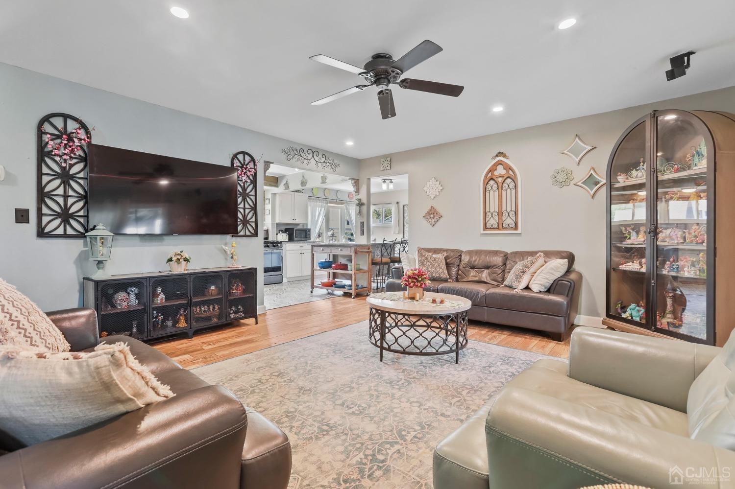 26 Sunrise Road Old Bridge, NJ 08857 - Photo 16 of 33 a living room with fireplace furniture and a flat screen tv