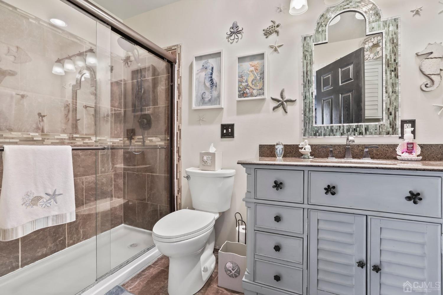 26 Sunrise Road Old Bridge, NJ 08857 - Photo 19 of 33 a bathroom with a sink a toilet and shower