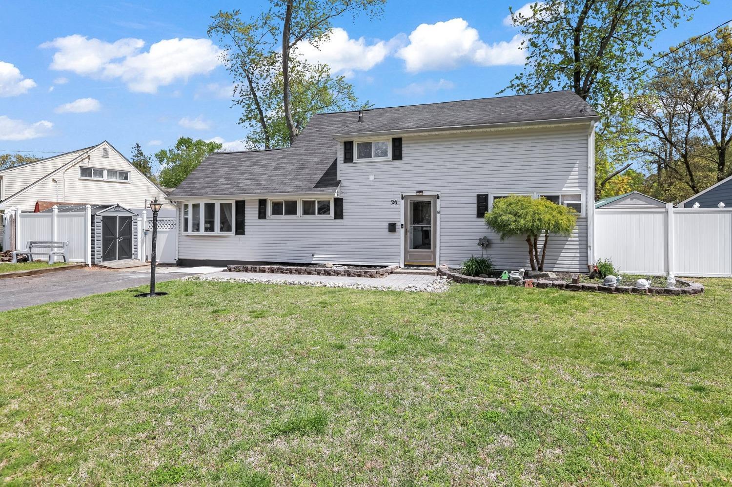 26 Sunrise Road Old Bridge, NJ 08857 - Photo 2 of 33 a front view of a house with a garden