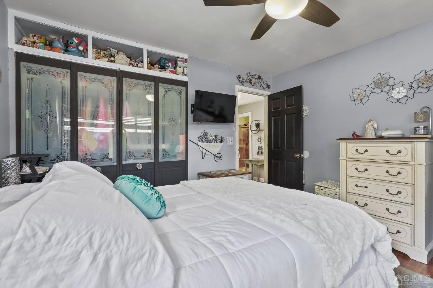 26 Sunrise Road Old Bridge, NJ 08857 - Photo 22 of 33 a bedroom with a large bed and a tv