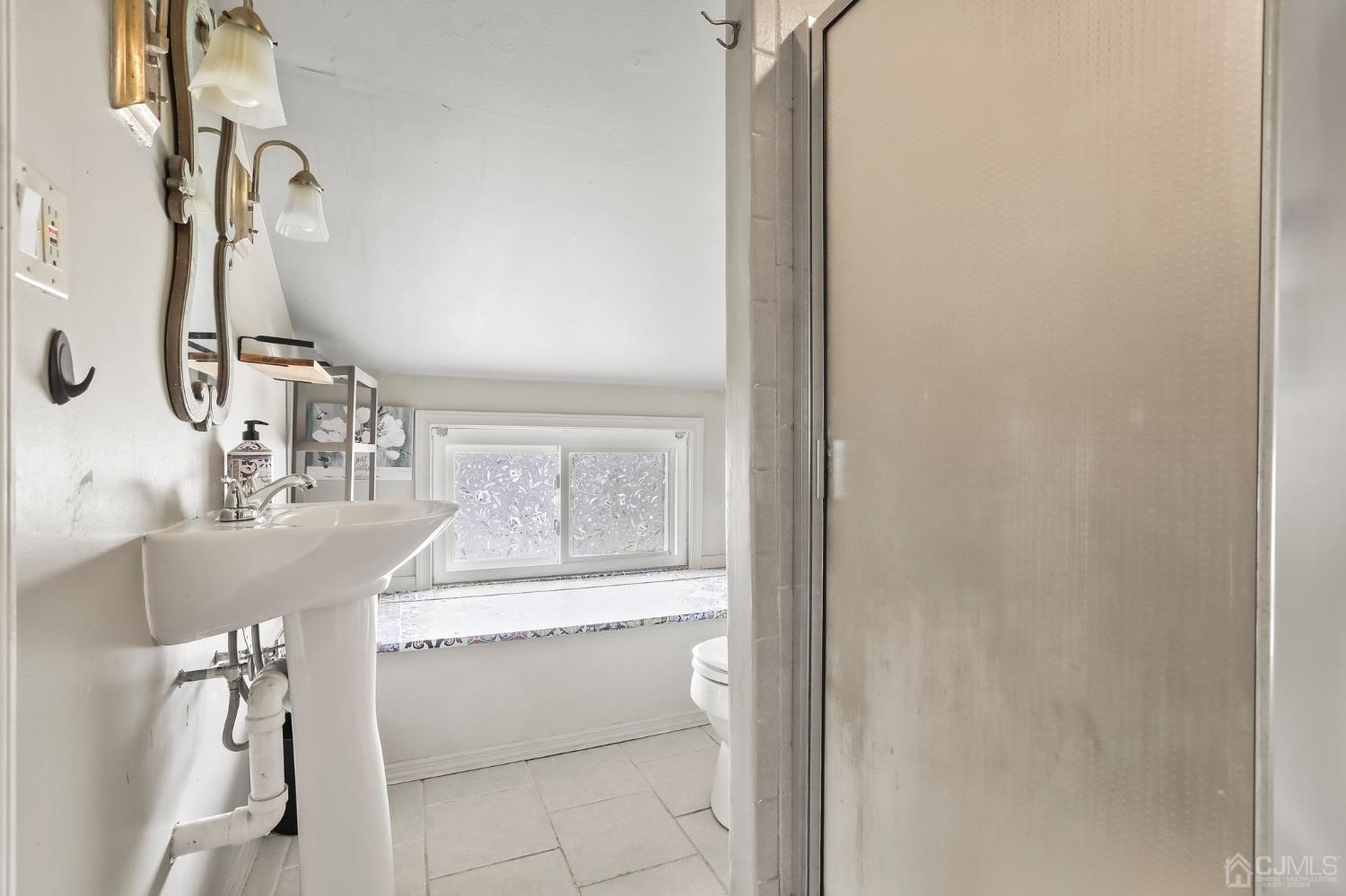 26 Sunrise Road Old Bridge, NJ 08857 - Photo 25 of 33 a bathroom with a bathtub sink and mirror