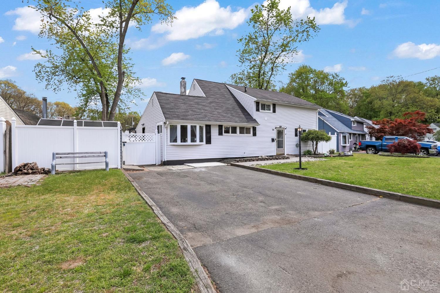 26 Sunrise Road Old Bridge, NJ 08857 - Photo 5 of 33 a house with garden in front of it