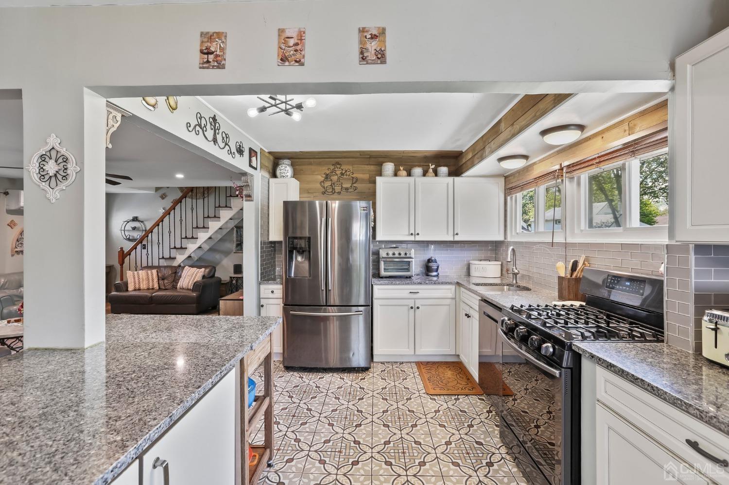 26 Sunrise Road Old Bridge, NJ 08857 - Photo 8 of 33 a kitchen with a refrigerator a sink and a stove