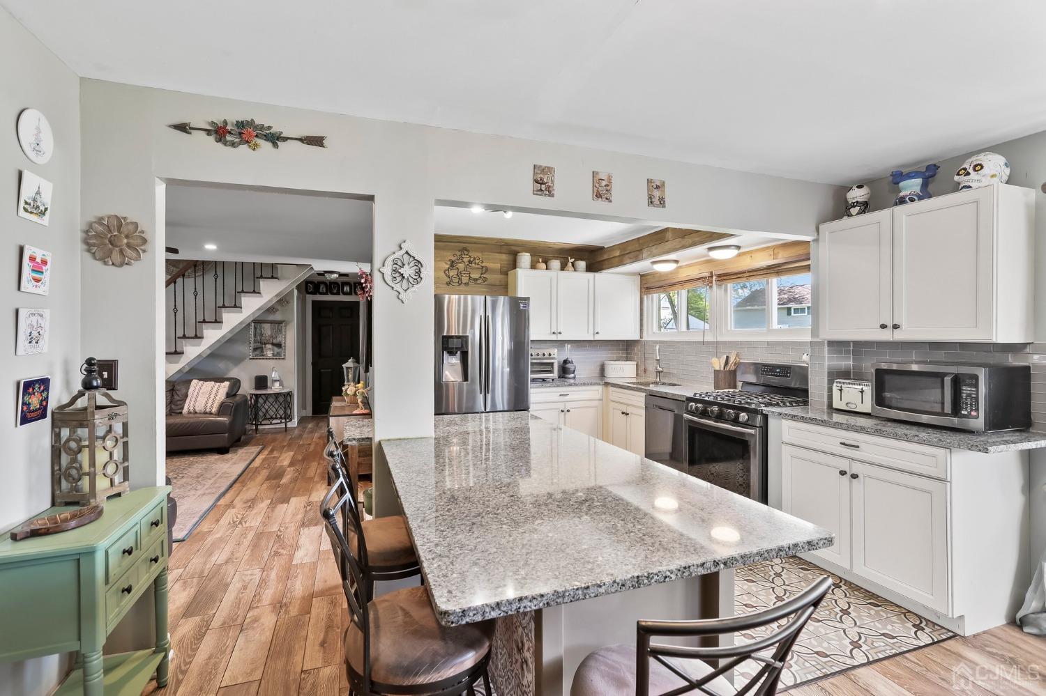 26 Sunrise Road Old Bridge, NJ 08857 - Photo 9 of 33 a large kitchen with cabinets table and chairs