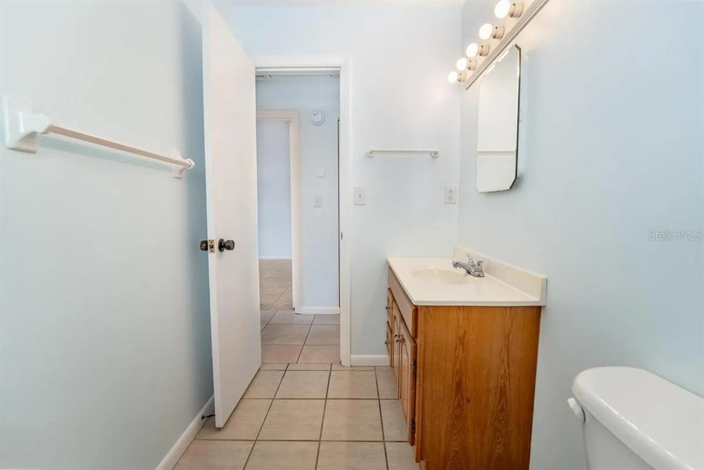 1021 Apollo Beach Boulevard, Unit 6 Apollo Beach, FL 33572 - Photo 14 of 18 a bathroom with a sink a toilet and shower