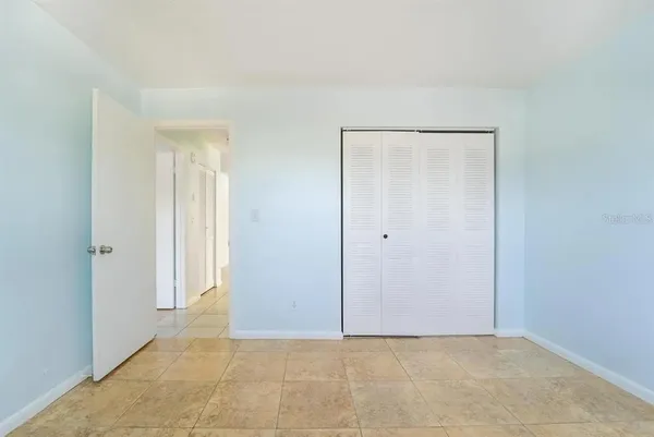 a view of a small space with wooden floor