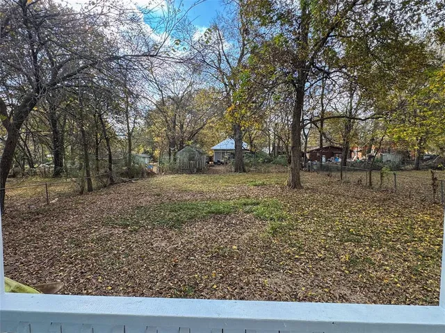 a backyard of a house with lots of green space