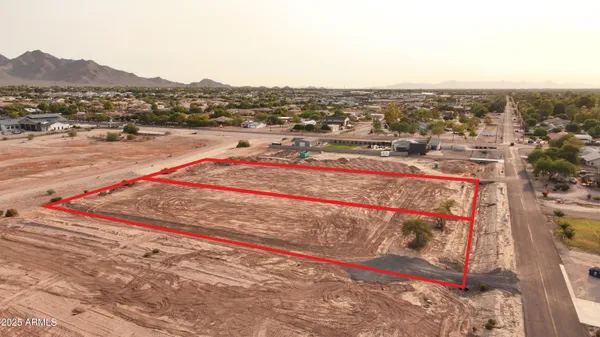 an aerial view of residential building with trees