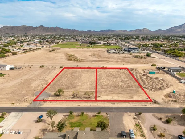 an aerial view of residential building with an ocean
