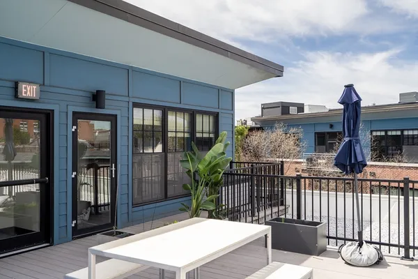 a view of a house with porch and furniture