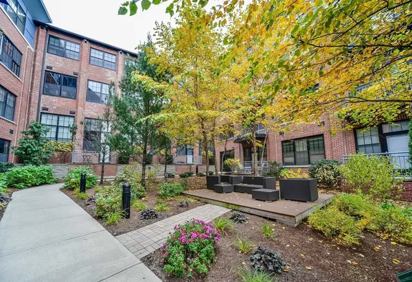 a front view of a building with garden