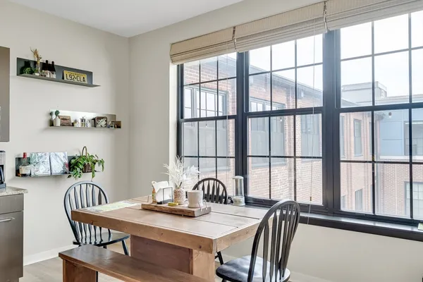 a view of a dining room with furniture window and outside view