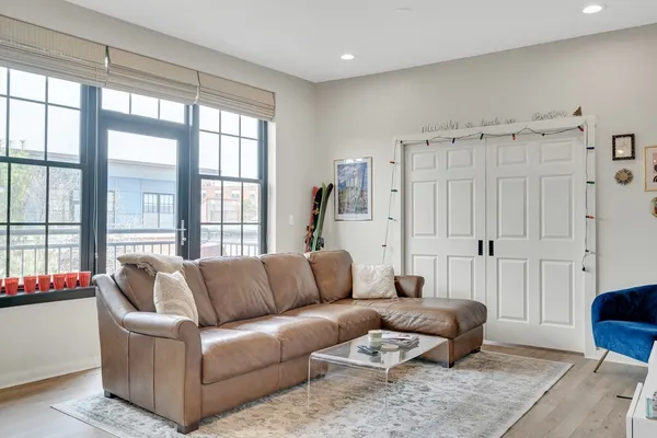 a living room with furniture and a large window