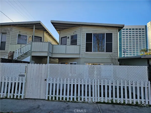 a front view of a house with a garage