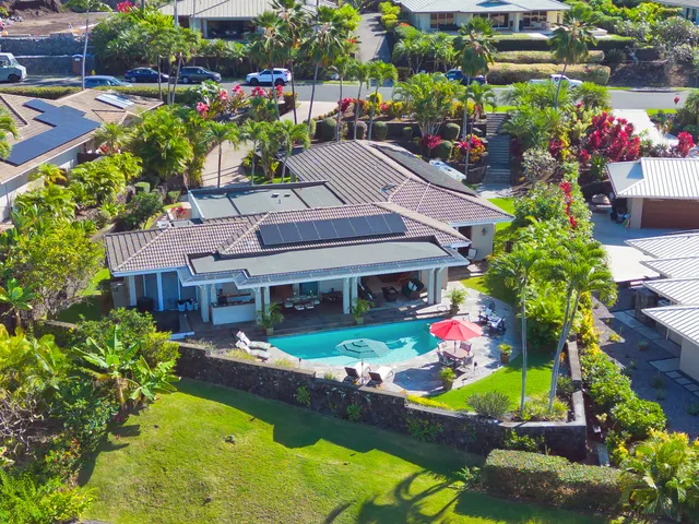 a view of a house with a yard and garden