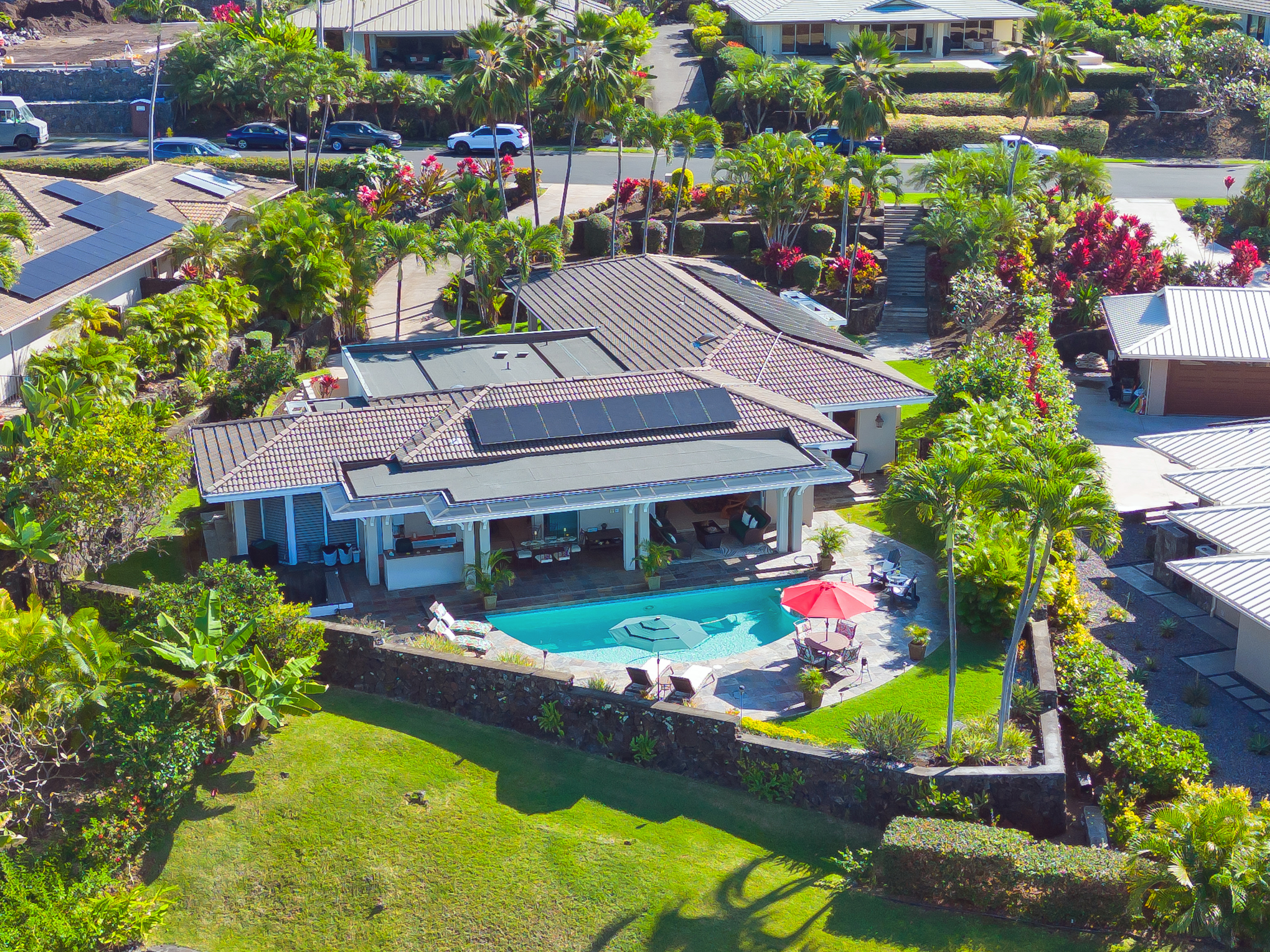 a view of a house with a yard and garden