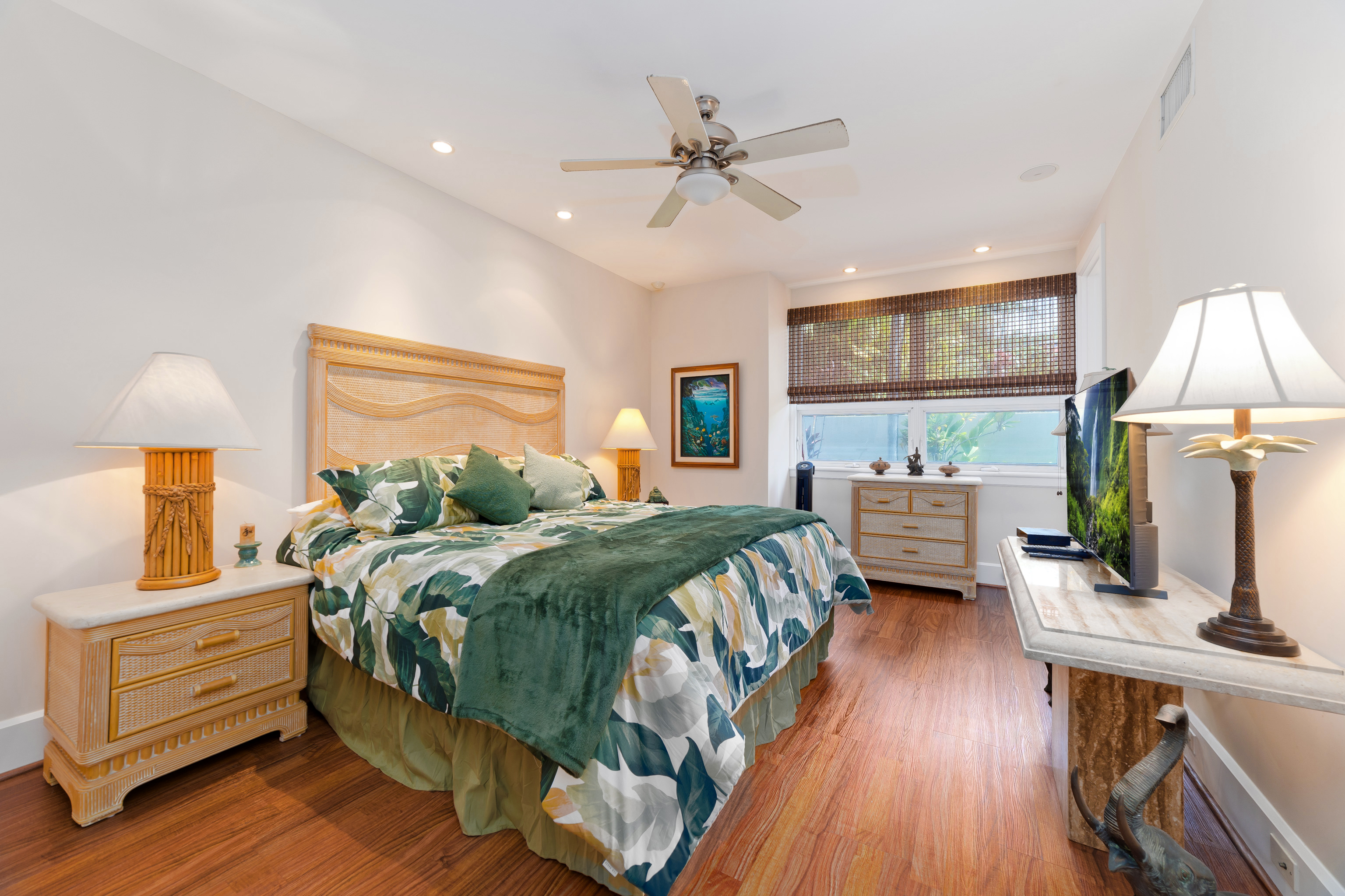 78-7018 Mololani Street Kailua-Kona, HI 96740 - Photo 14 of 30 a bedroom with a bed and wooden floor