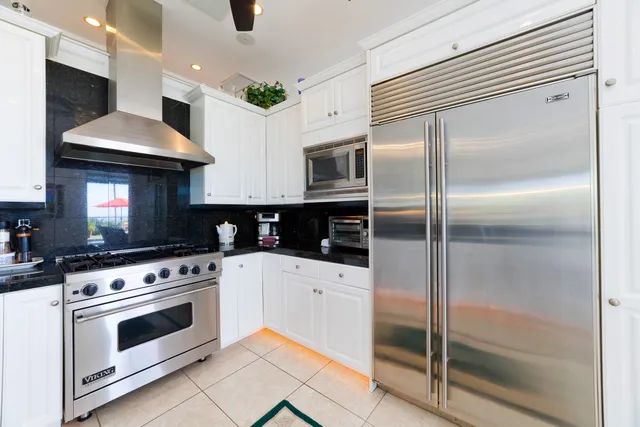 a kitchen with a stove and a refrigerator