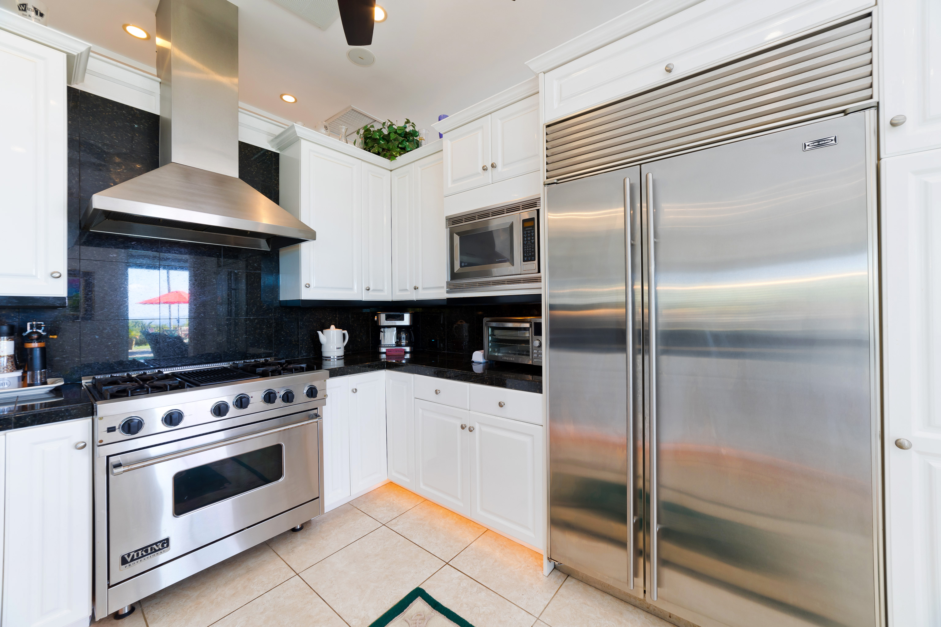 78-7018 Mololani Street Kailua-Kona, HI 96740 - Photo 17 of 30 a kitchen with a stove and a refrigerator
