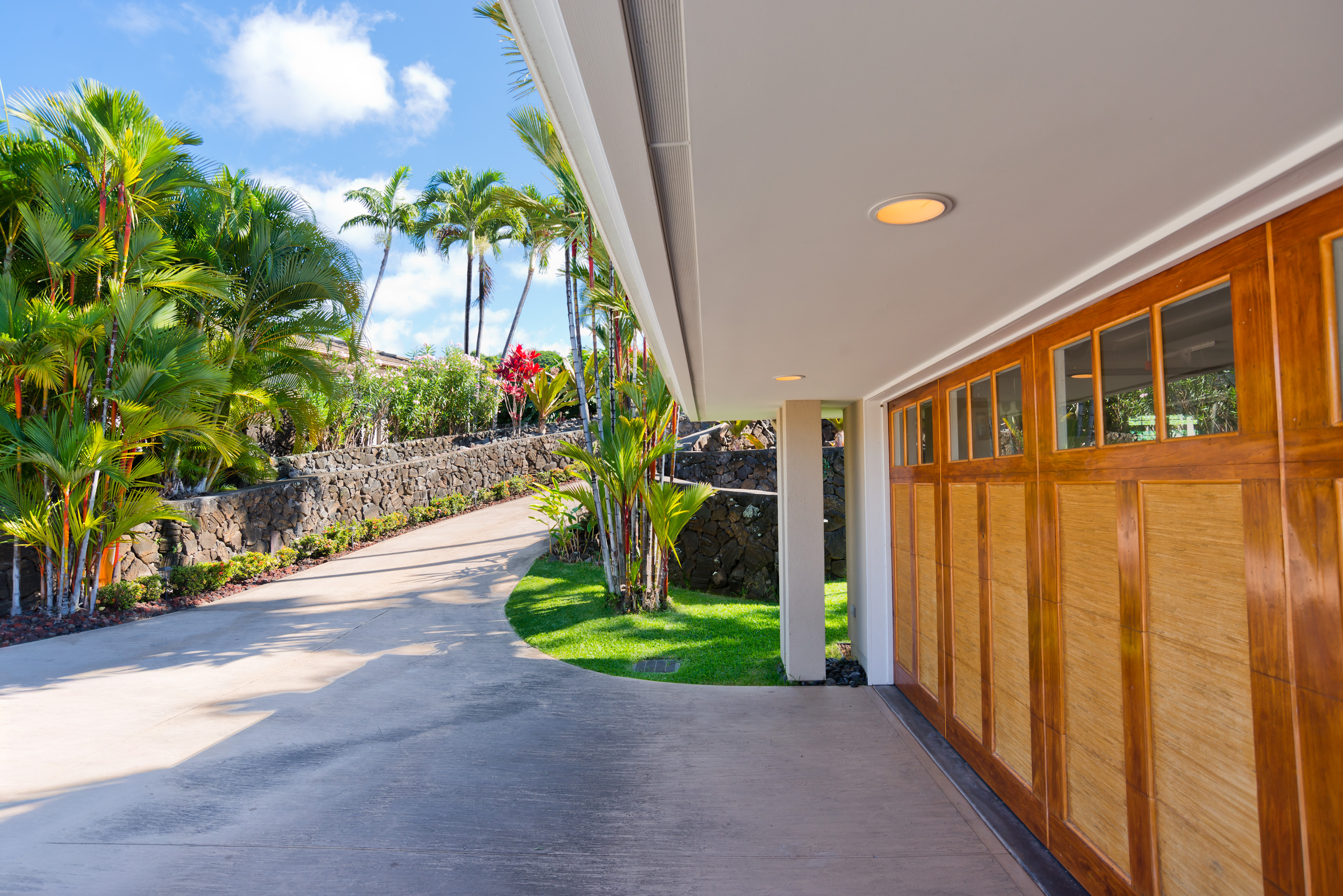 78-7018 Mololani Street Kailua-Kona, HI 96740 - Photo 25 of 30 a front view of a house with a yard and potted plants