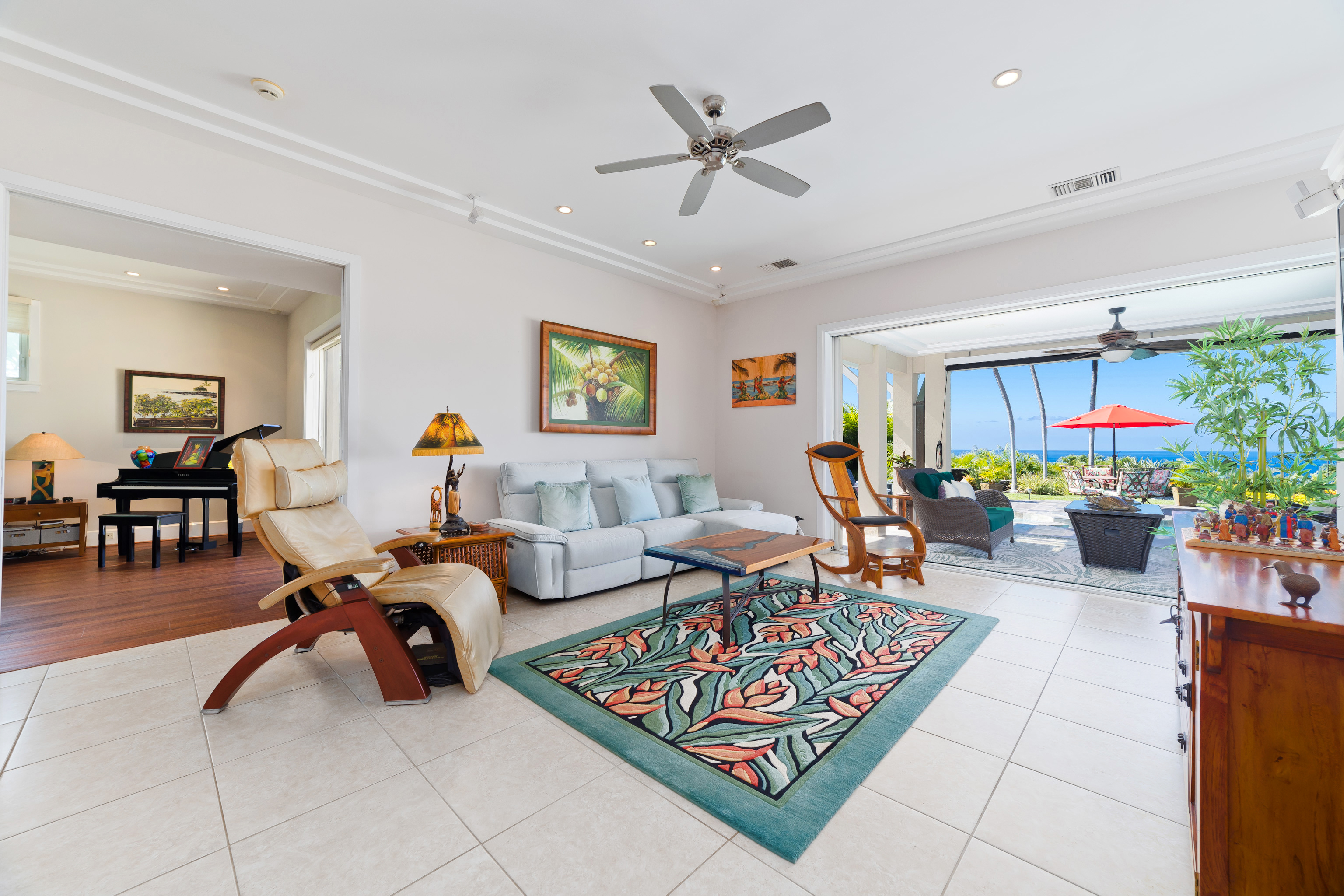 78-7018 Mololani Street Kailua-Kona, HI 96740 - Photo 4 of 30 a living room with furniture a dining table and a potted plant