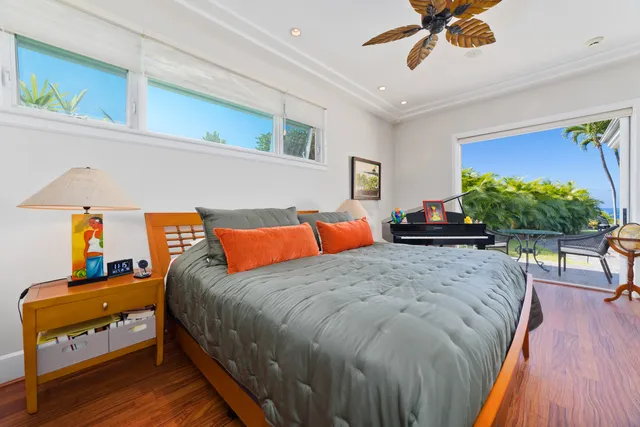 a bed room with a bed and a chandelier