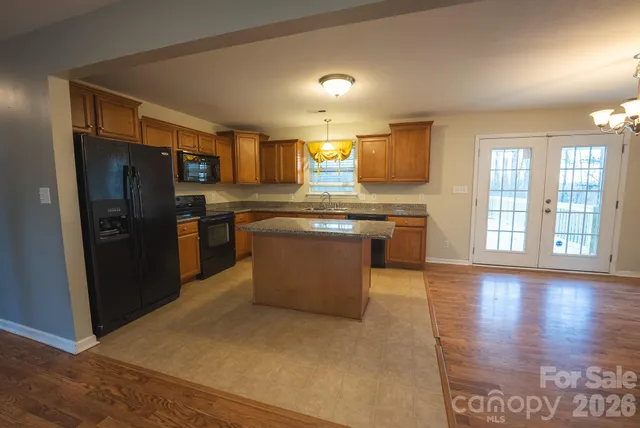 a view of an house with a wooden deck