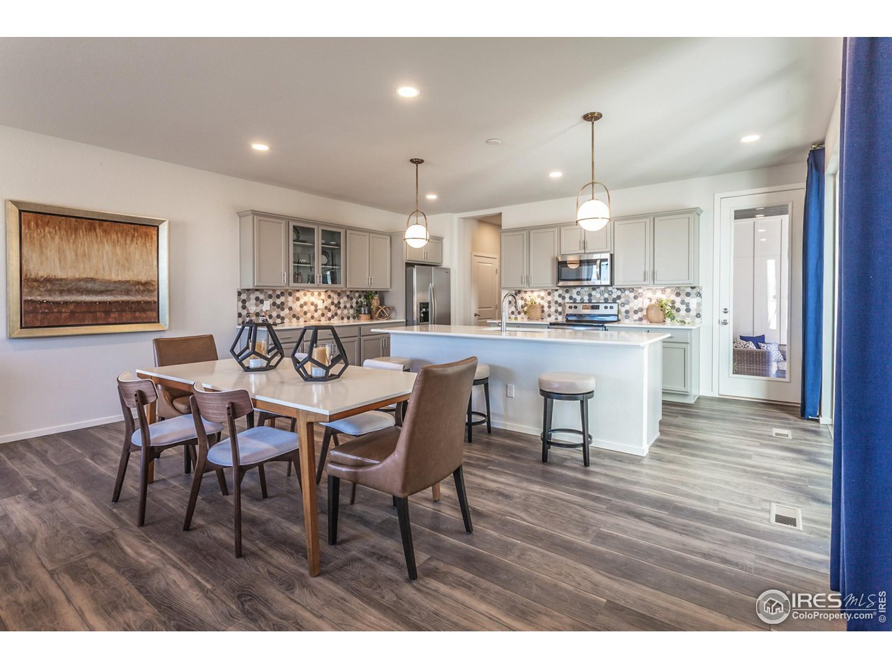 6101 Sublette Road Timnath, CO 80547 - Photo 14 of 34 a view of a dining room with furniture window and wooden floor