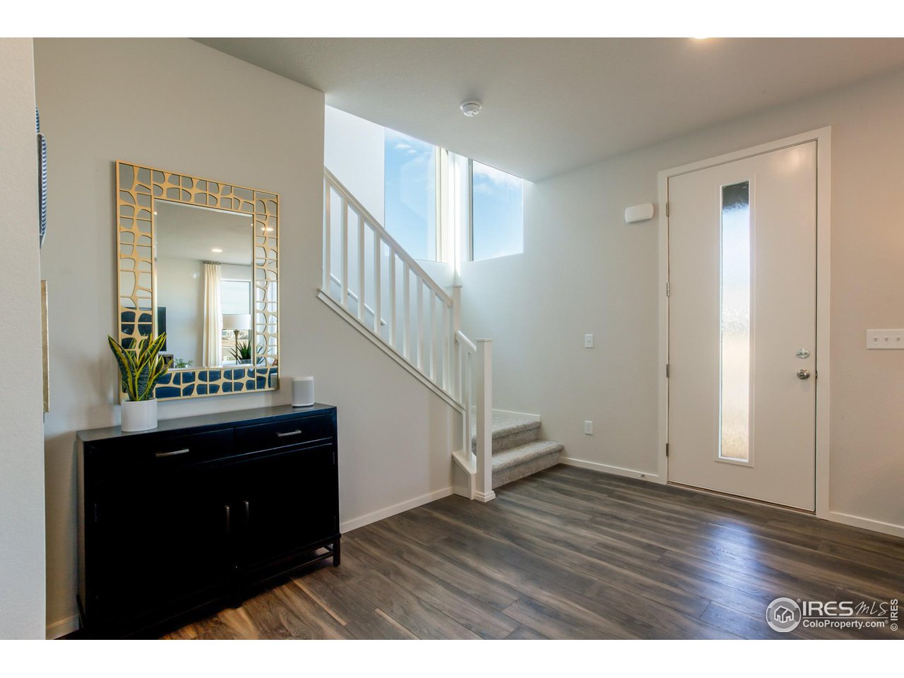 6101 Sublette Road Timnath, CO 80547 - Photo 16 of 34 a view of an entryway with wooden floor