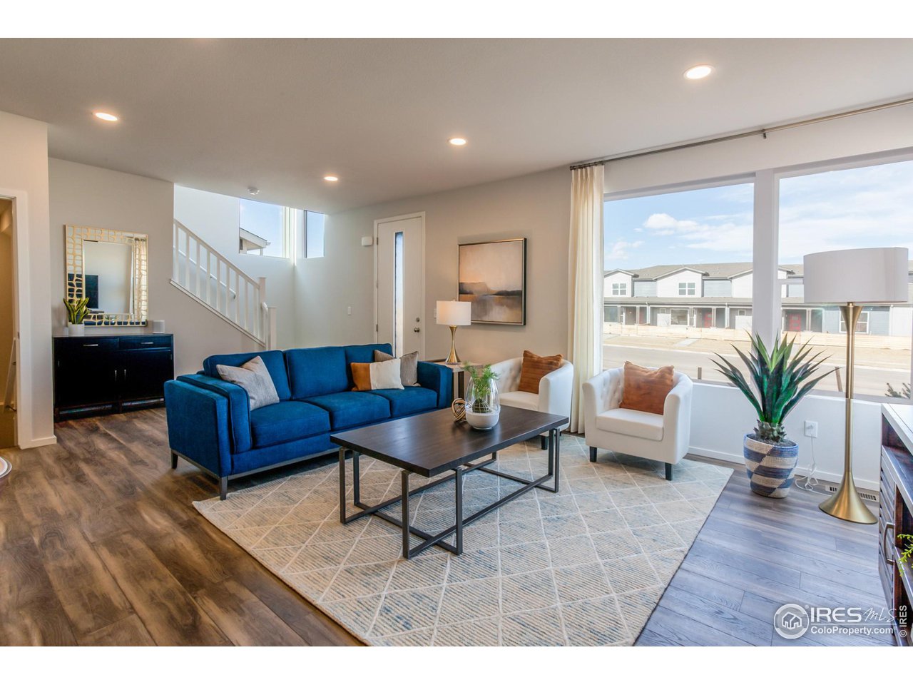 6101 Sublette Road Timnath, CO 80547 - Photo 2 of 34 a living room with furniture and a large window