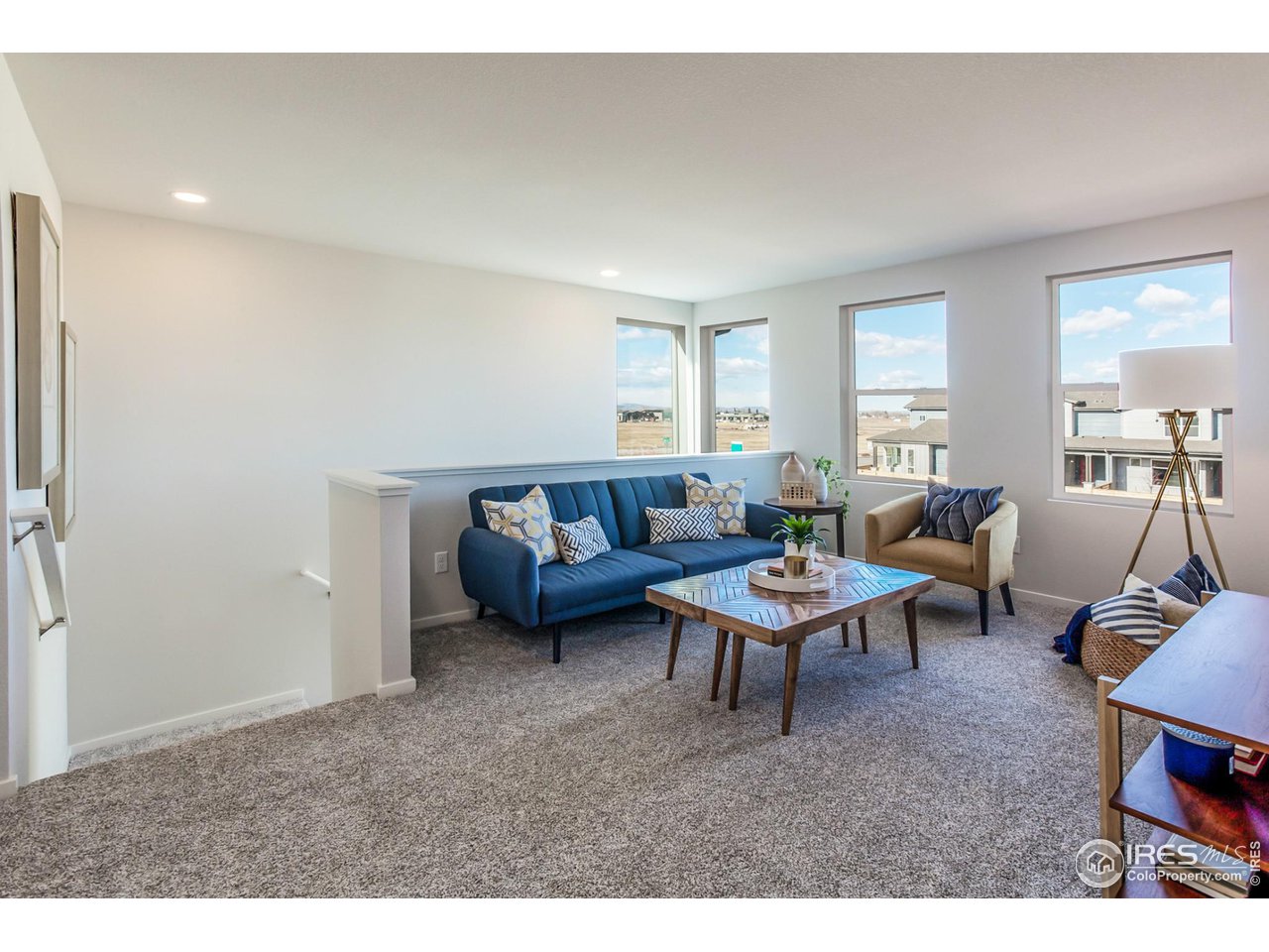 6101 Sublette Road Timnath, CO 80547 - Photo 20 of 34 a living room with furniture a window and a table