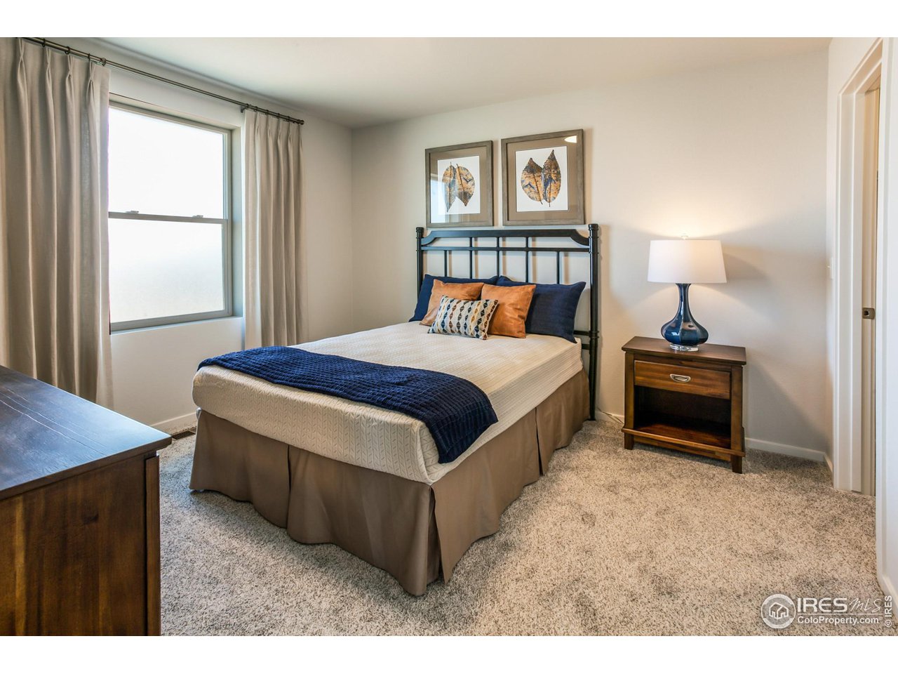 6101 Sublette Road Timnath, CO 80547 - Photo 25 of 34 a bedroom with a bed and a window