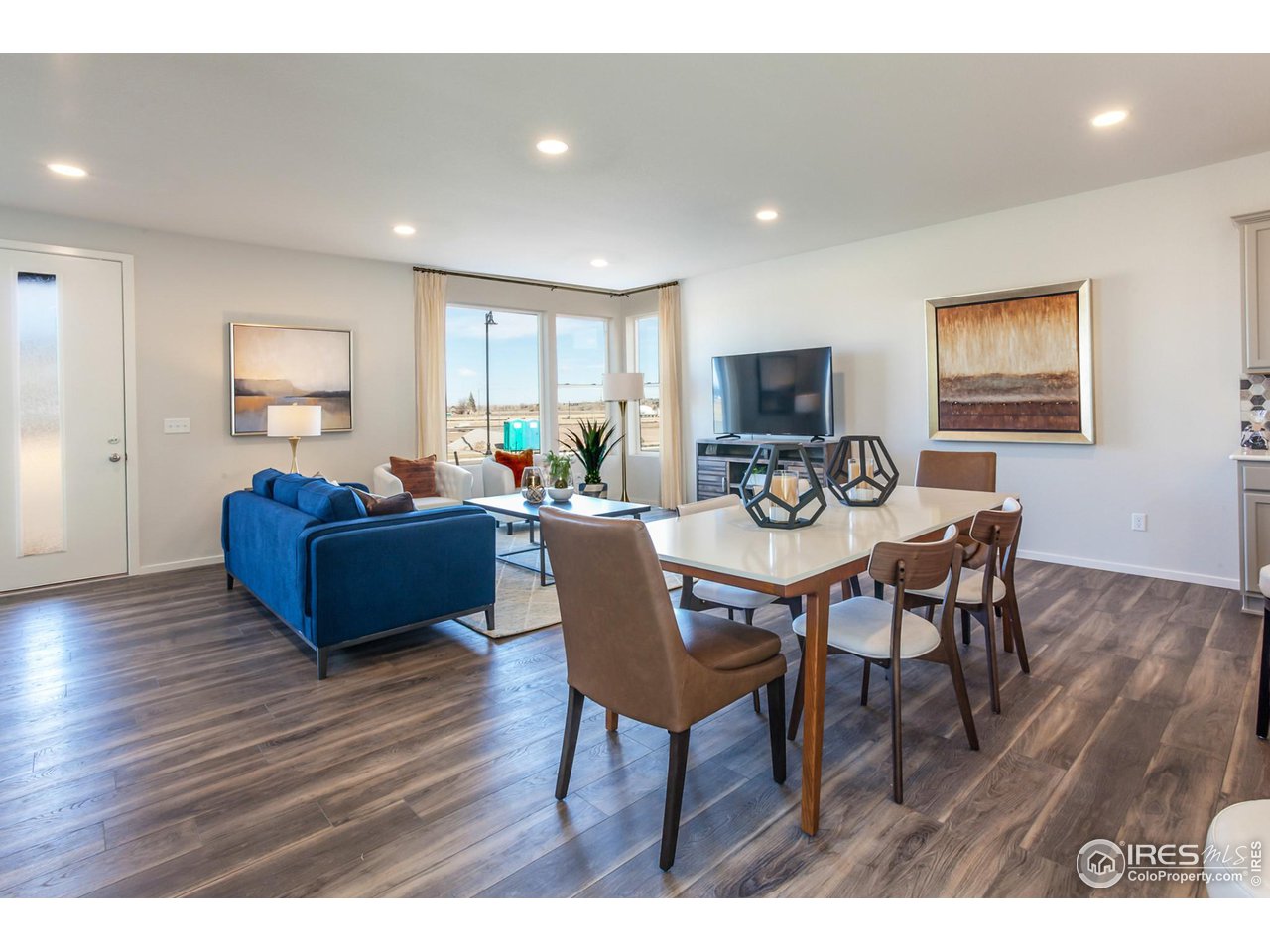 6101 Sublette Road Timnath, CO 80547 - Photo 6 of 34 a living room with furniture and a wooden floor