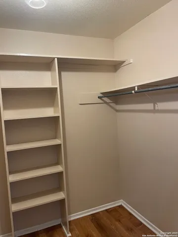 a view of a room with shelf on the wall