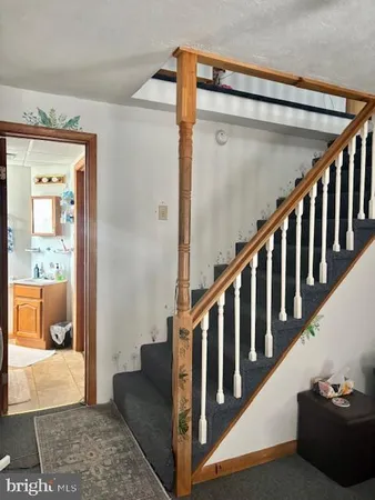 a view of a livingroom with a staircase